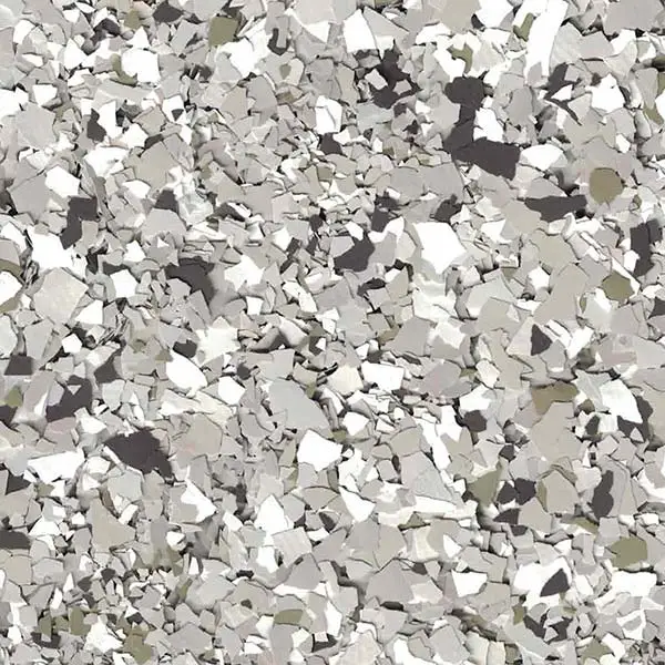 This image shows a scattered pattern of irregular, randomly sized rocks or concrete fragments, creating an abstract, textured appearance in shades of gray and white.