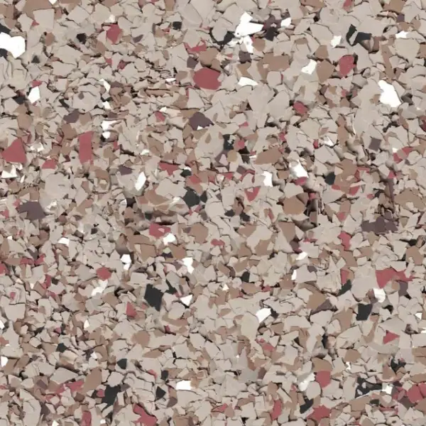 Close-up of a terrazzo surface with multicolored stone chips in beige, brown, pink, and white.