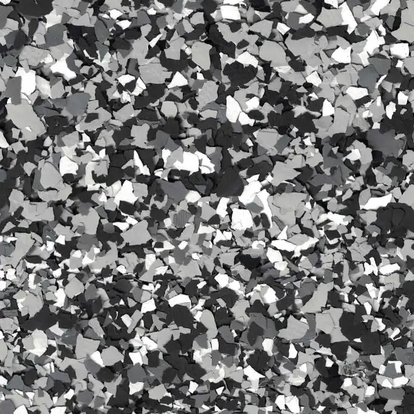 Black, white, and gray terrazzo pattern with irregularly shaped chips, creating a speckled mosaic effect. Suitable for modern flooring or surfaces.